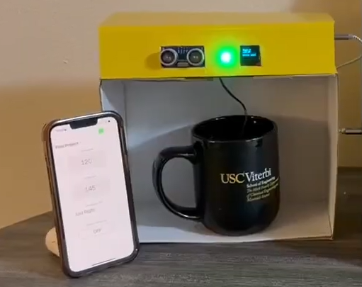 Madelyn's beverage tracker dispensing a drink into a mug